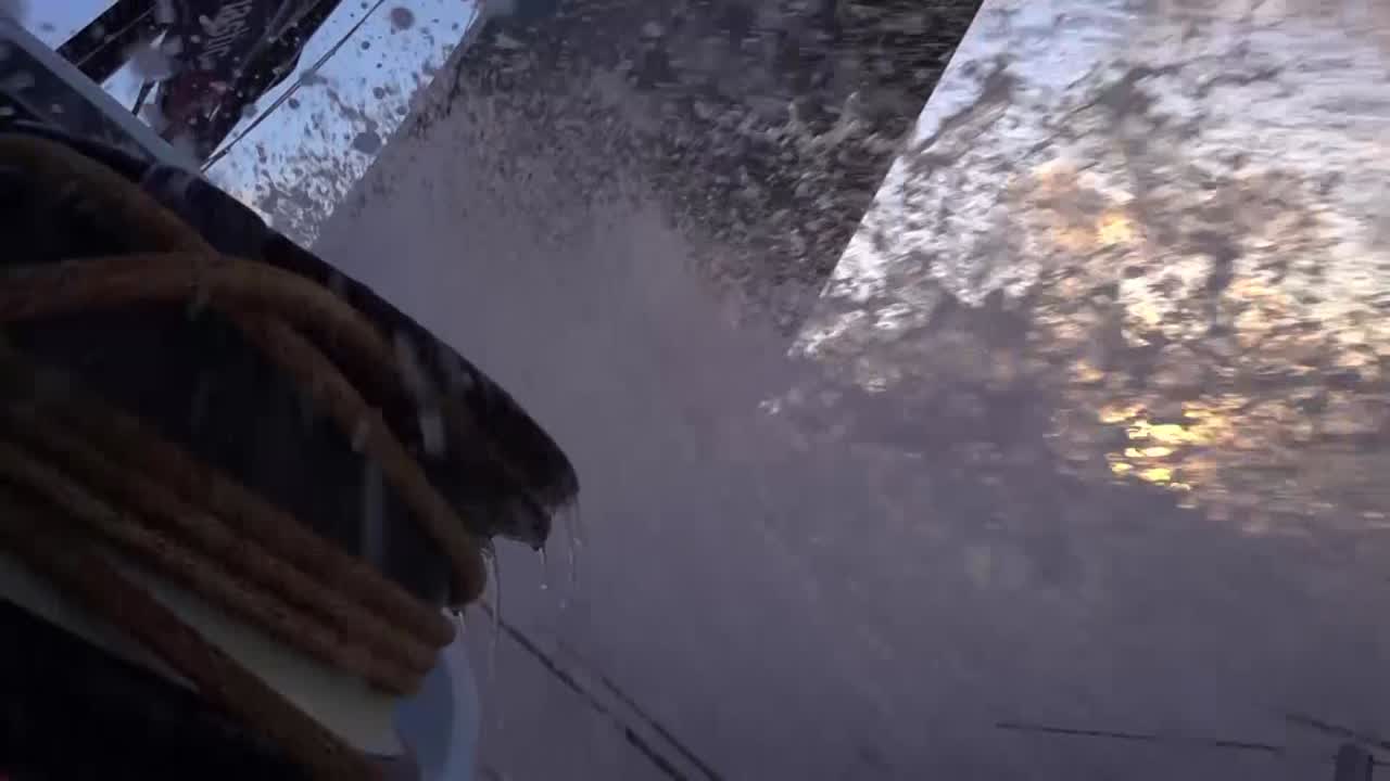 Slomo shot, with spray, looking up the slot at sunset.