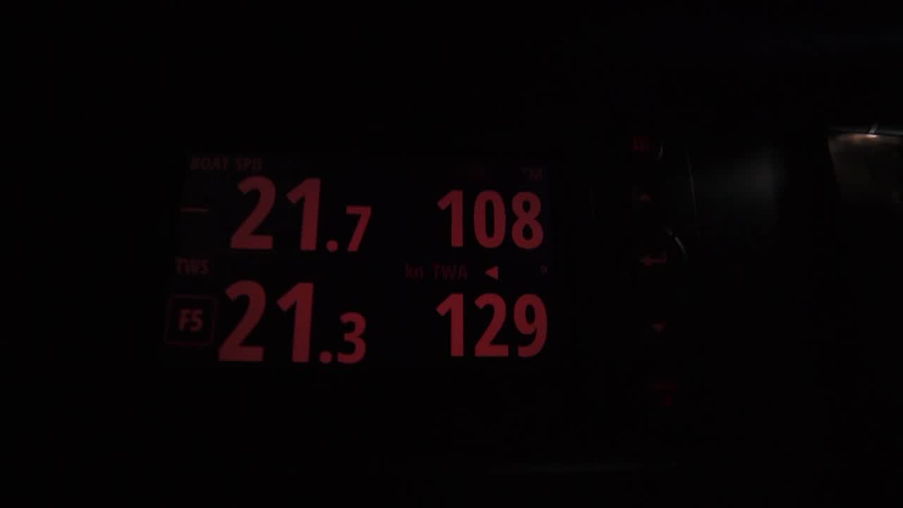 At the nav station we see an AIS screen (I think?). Steve talks about how they did a good job overnight holding onto the "big sail", and have stayed in the front, making a 7-mile gain on TTToP. Also, AkzoNobel has been farther to the south and has made a big loss. Steve: "We've just made an 18-mile gain on them." Shot out the cabin of Alex and Parko (steering) in the cockpit. Below, Witty talks about how they've done well, looking forward to finding out if it's continued in a few minutes. After getting the sched, Steve announces that they're ahead of AkzoNobel. Witty: "Yes!" In the pit, Ben says he's happy about it.