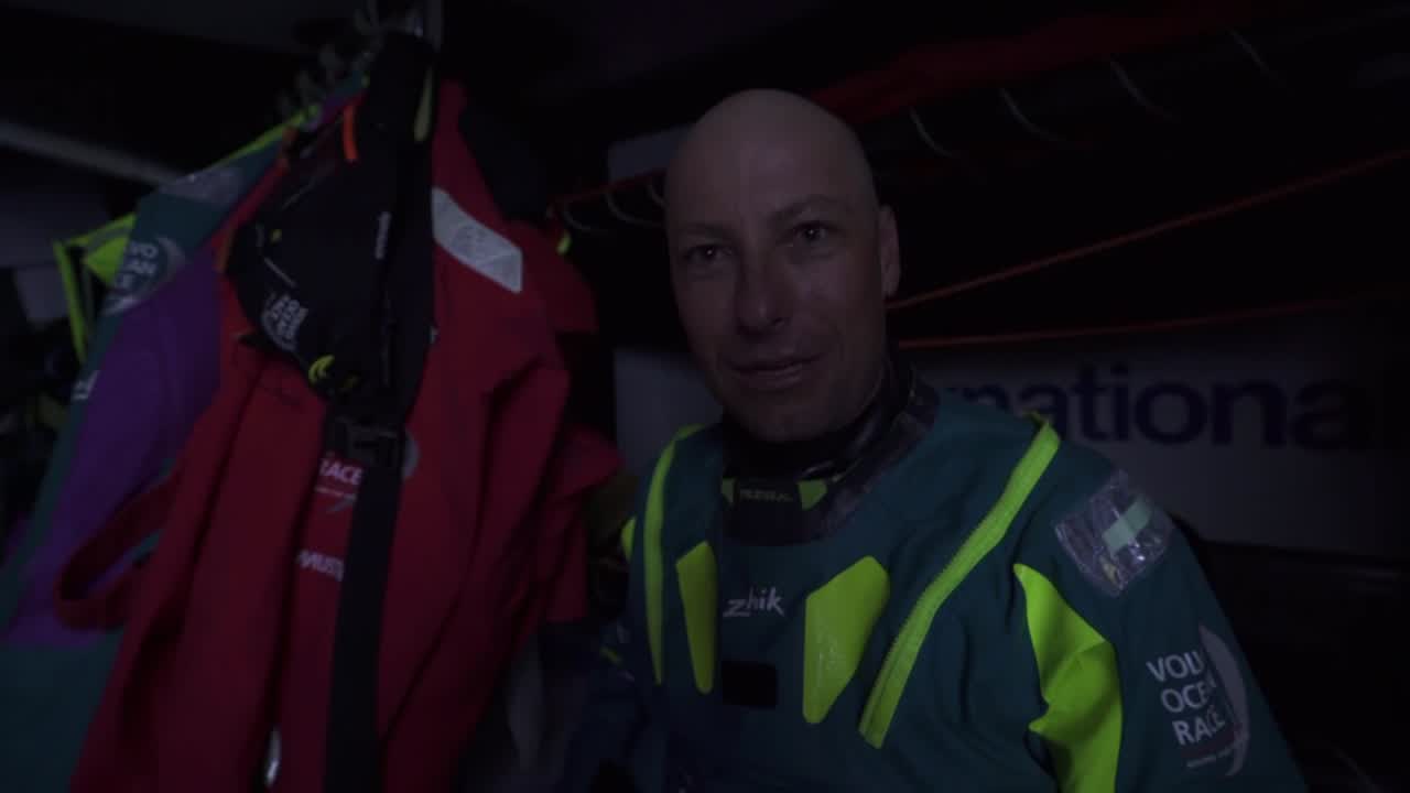 Luke, below: First night at sea seemed long, bashing upwind, tacking, not a lot of sleep. But East Cape in a few hours and then downwind and an end to tacking. Someone calls from the companionway to the cockpit: "We should be crossing them". Nicho on deck with two boats to leeward. Chipping away; not sure if we're any faster. Brunel crosses behind them. Luke, Emily, and Brad getting dressed below. Luke: About to go around East Cape, in joint third position with Brunel. Looking forward to a few days on port tack heading south toward the Southern Ocean. Brad eating. Had an hour and half of good sleep. Emily: Nah, had a full 12 hours of beauty sleep. You can tell by the hair, and always so charming. Brunel and TTToP sailing to leeward.