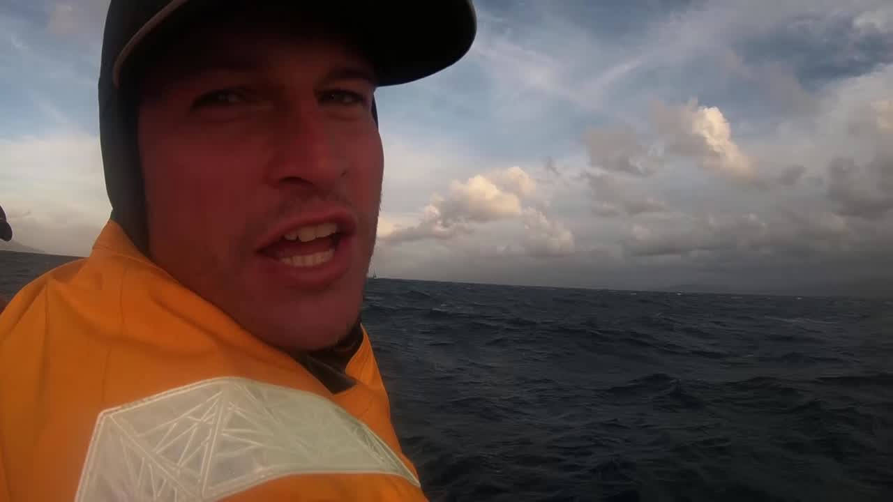 Henry, on the weather rail, talks about the first few hours of the race. He sounds a little seasick. Aft of Sam, Frederico shakes the water off his head with the sunset behind him, talks about how nervous he was this morning. So dangerous, so many obstacles, low pressure, Cape Horn. Now he's more relaxed; they've started. But it's pretty epic. Liz, on the helm: If you want to do the VOR, this is the leg you think of first. Every offshore sailor's dream. Brian: He's done two legs with this crew, and he's seen how much they've approved. They're not newbies down there. Their learning curve has gone up really high. Have enough experience and common sense now to deal with the south. Talks about easing into it; 25 knots upwind now, and when they get to the Southern Ocean won't be blowing dogs off chains straightaway.